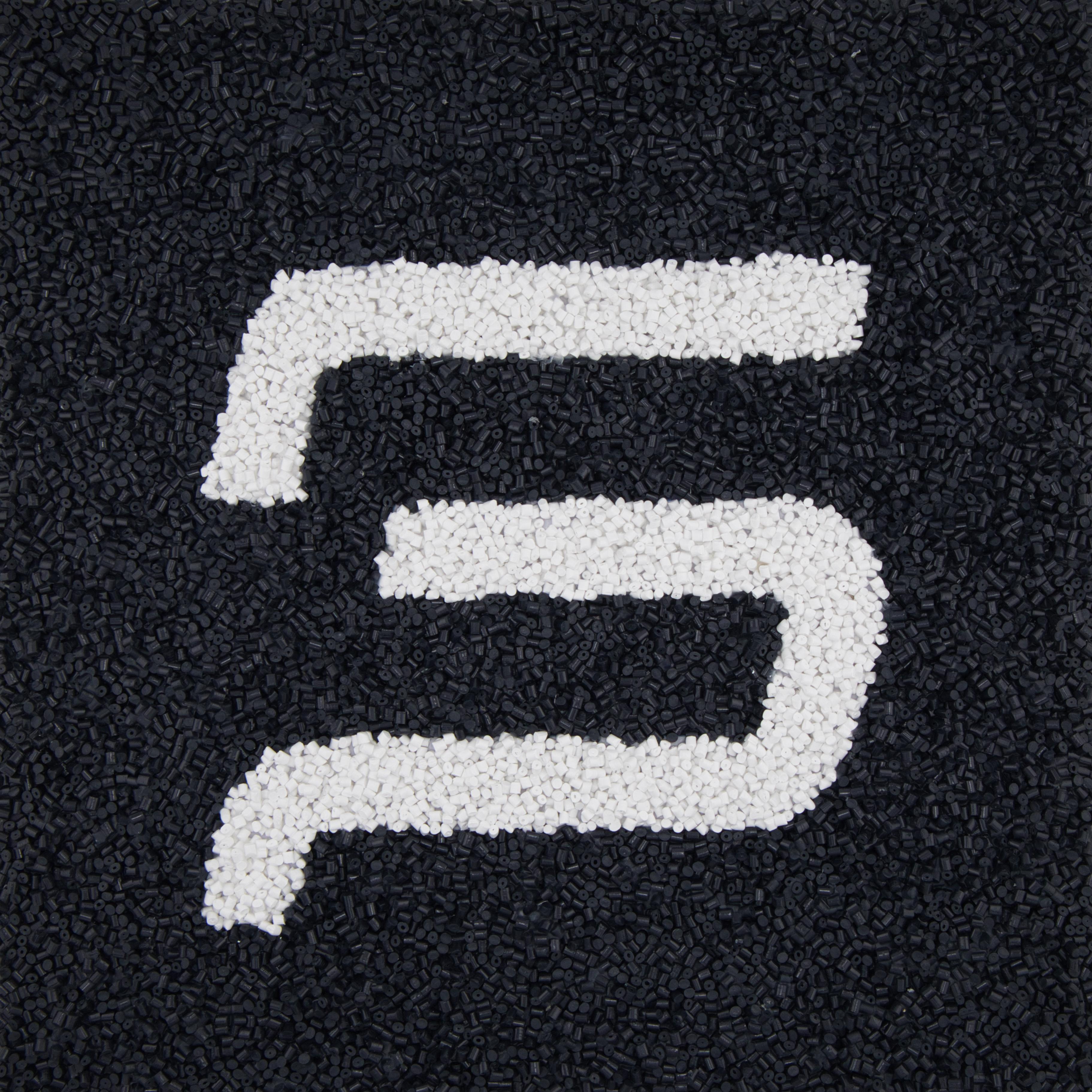 Engineers inspecting a high-precision injection moulding line.