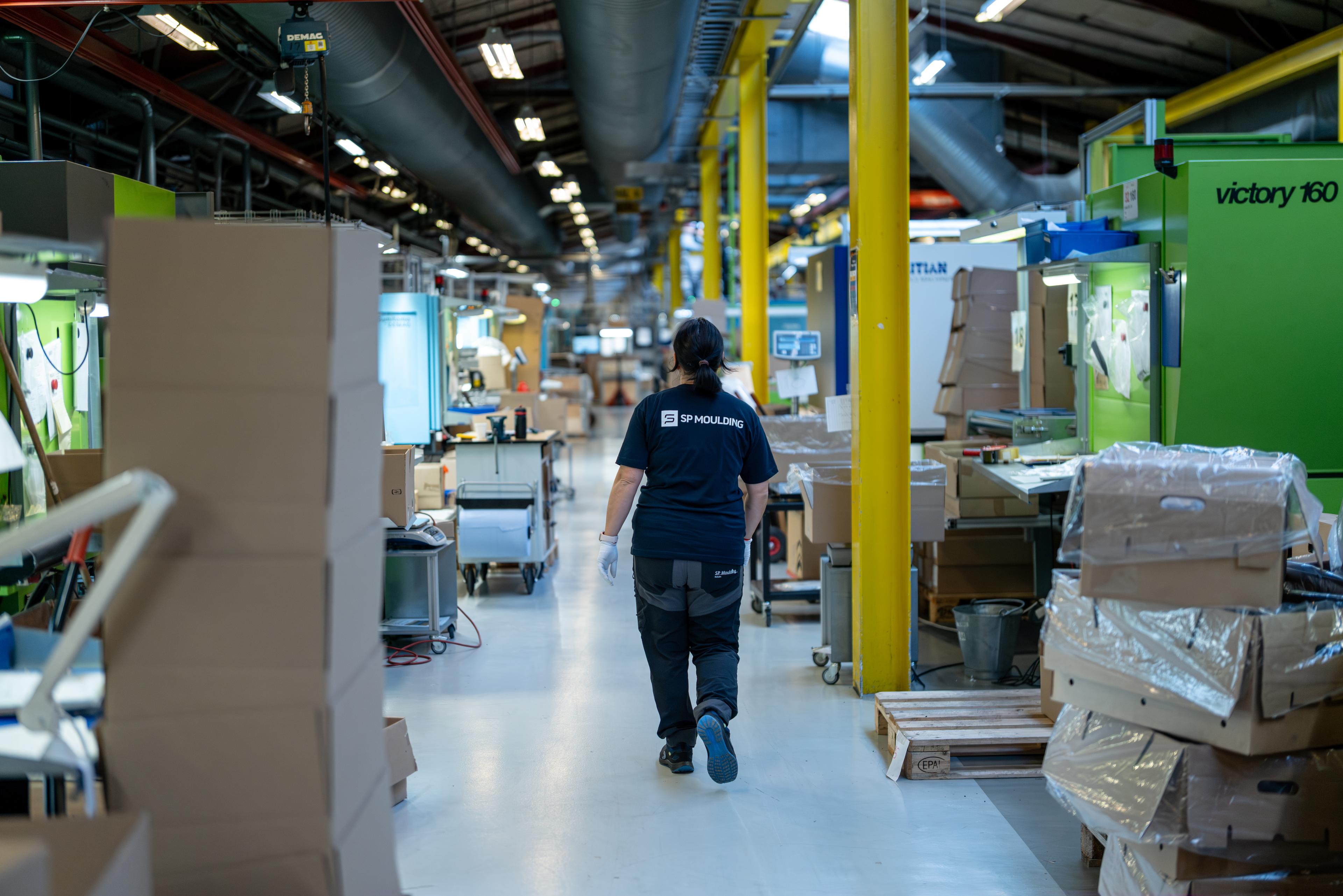 SP Moulding team working with machinery